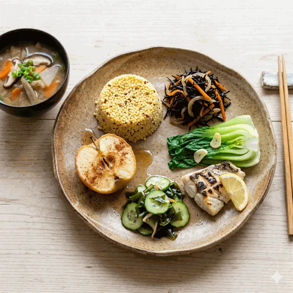 Macrobiotic evening plate with vegetable miso soup, millet, hijiki seaweed and steamed greens